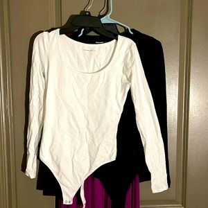 Womens Soft Small Black and White bodysuits. Items are sold.